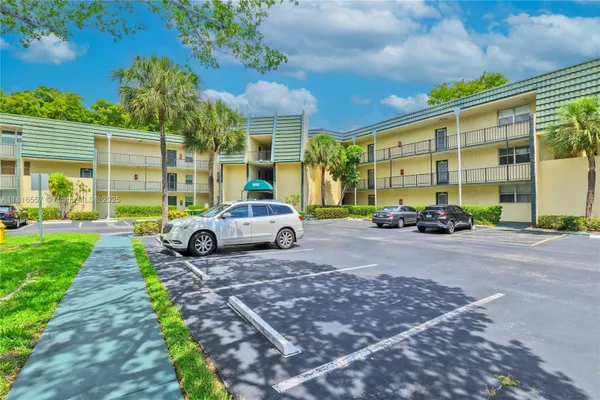Property Slideshow image 3 of 49 | 9091 lime bay blvd 211, Tamarac, FL, 33321