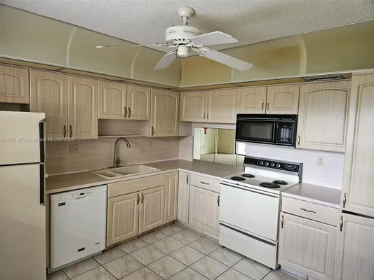 Property Slideshow image 2 of 13 | 4940 e sabal palm blvd 312, Tamarac, FL, 33319