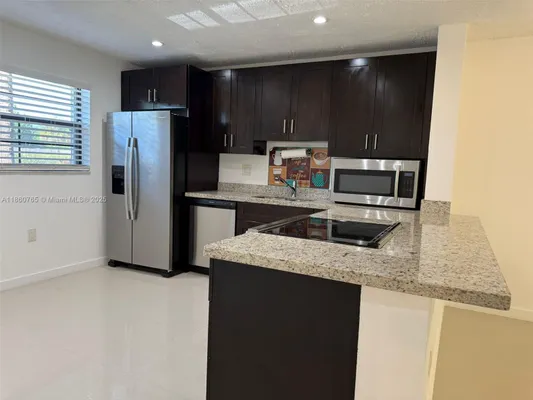 Property Slideshow image 2 of 34 | 6095 n sabal palm blvd apt 103, Tamarac, FL, 33319