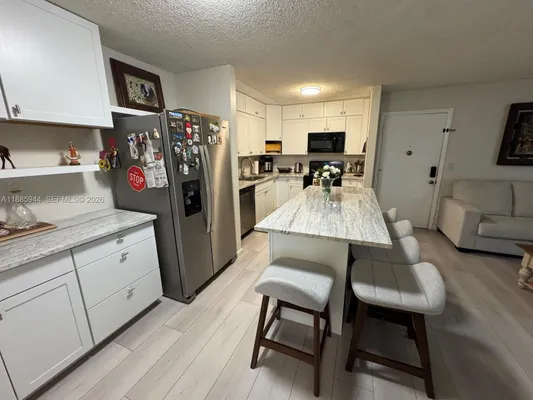 Property Slideshow image 2 of 13 | 10425 e clairmont cir 107, Tamarac, FL, 33321