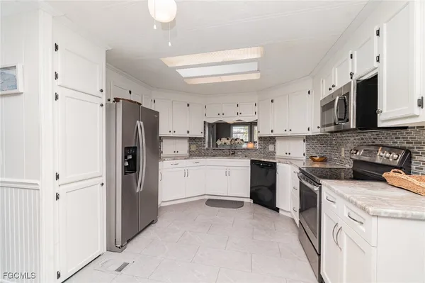 Property Slideshow image 2 of 31 | 5508 colonial rd, North Fort Myers, FL, 33917