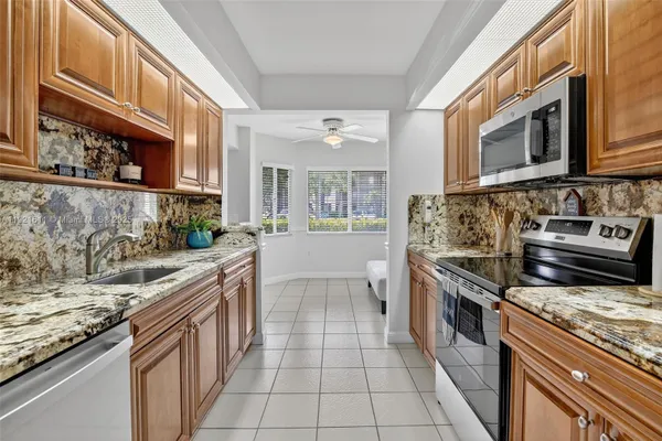Property Slideshow image 2 of 59 | 13705 sw 12th st 103b, Pembroke Pines, FL, 33027