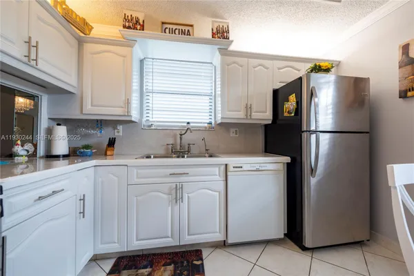Property Slideshow image 3 of 25 | 4940 e sabal palm blvd apt 414, Tamarac, FL, 33319