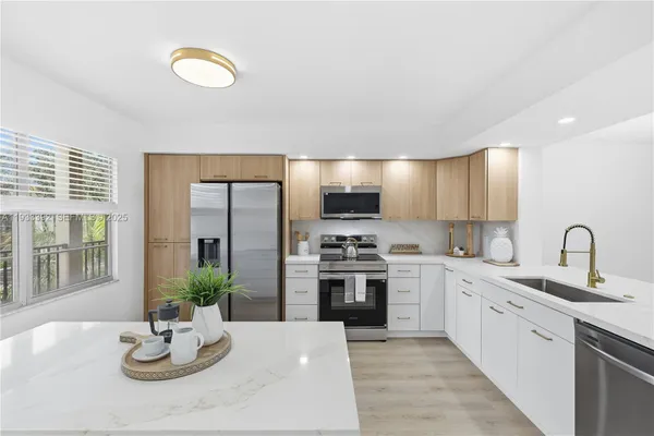 Property Slideshow image 2 of 49 | 1101 sw 128th ter apt c313, Pembroke Pines, FL, 33027