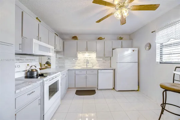 Property Slideshow image 3 of 30 | 4955 e sabal palm blvd 305, Tamarac, FL, 33319