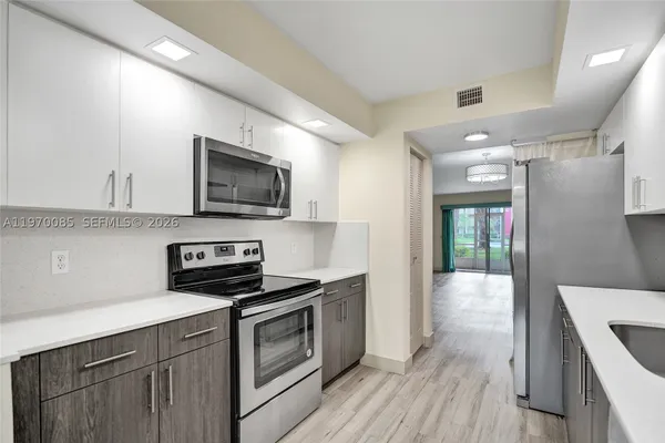 Property Slideshow image 2 of 37 | 12750 sw 4th ct 111j, Pembroke Pines, FL, 33027