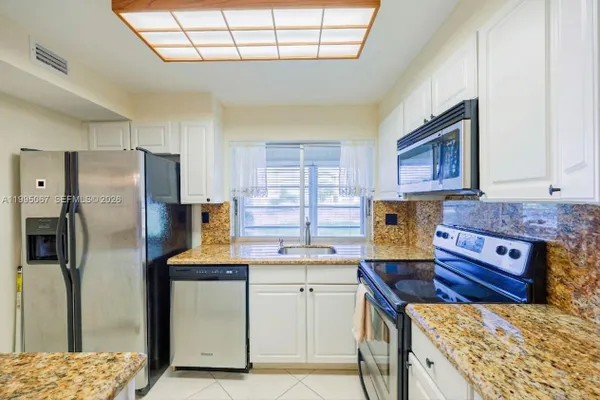 Property Slideshow image 3 of 34 | 9150 lime bay blvd 110, Tamarac, FL, 33321