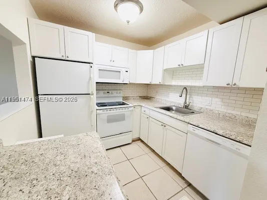 Property Slideshow image 2 of 31 | 3061 nw 47th ter 228b, Lauderdale Lakes, FL, 33313
