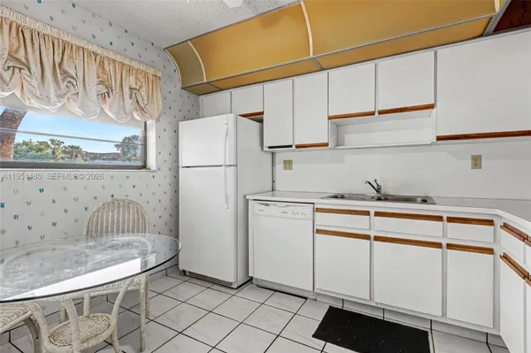 Property Slideshow image 3 of 23 | 6085 n sabal palm blvd 208, Tamarac, FL, 33319