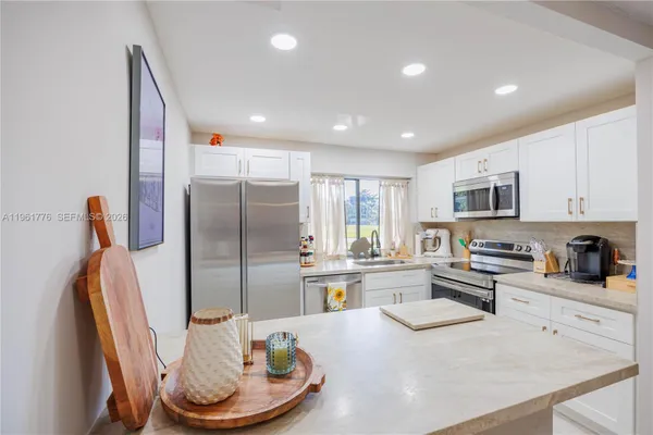 Property Slideshow image 3 of 38 | 9100 lime bay blvd 111, Tamarac, FL, 33321