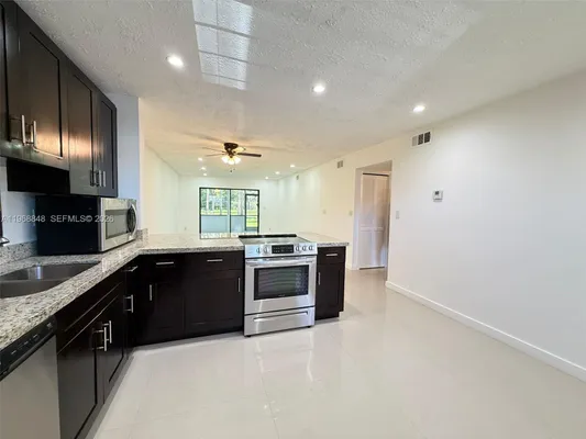Property Slideshow image 2 of 34 | 6095 n sabal palm blvd apt 103, Tamarac, FL, 33319