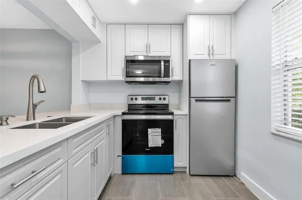 Property Slideshow image 2 of 23 | 9091 lime bay blvd 312, Tamarac, FL, 33321