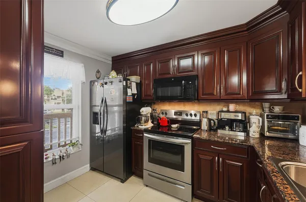 Property Slideshow image 2 of 27 | 5750 nw 64th ave apt 211, Tamarac, FL, 33319