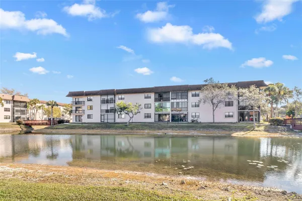 Property Slideshow image 2 of 42 | 4975 e sabal palm blvd 408, Tamarac, FL, 33319