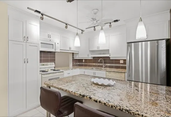Property Slideshow image 2 of 23 | 6095 n sabal palm blvd 210, Tamarac, FL, 33319