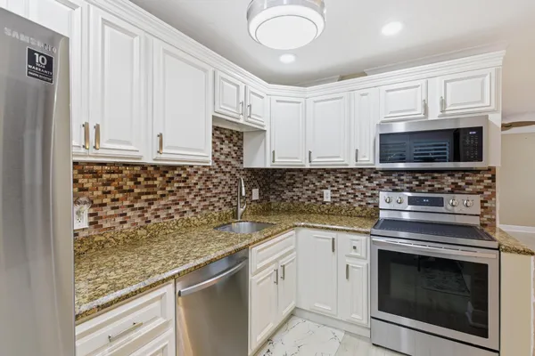 Property Slideshow image 3 of 10 | 34 colonial club dr 101, Boynton Beach, FL, 33435