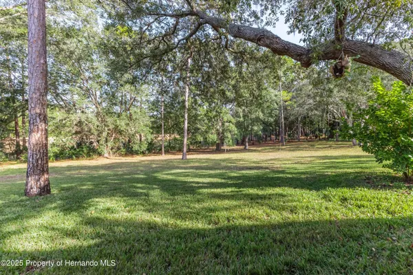 Property Slideshow image 3 of 70 | 3008 whispering pines ct, Spring Hill, FL, 34606