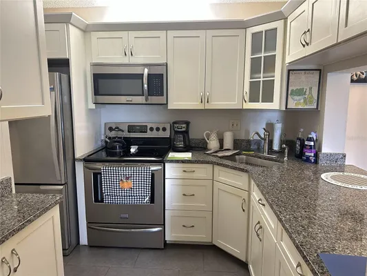 Property Slideshow image 2 of 15 | 1871 pine ridge way 2e, Palm Harbor, FL, 34684