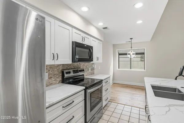 Property Slideshow image 3 of 65 | 212 kings trl a, Sunset Beach, NC, 28468