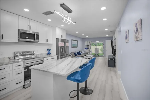 Property Slideshow image 3 of 56 | 1701 pinehurst rd 33e, Dunedin, FL, 34698