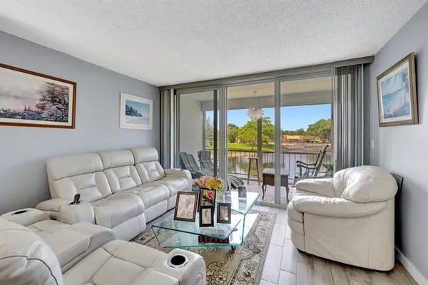 Property Slideshow image 2 of 31 | 5860 nw 64th ave apt 201, Tamarac, FL, 33319