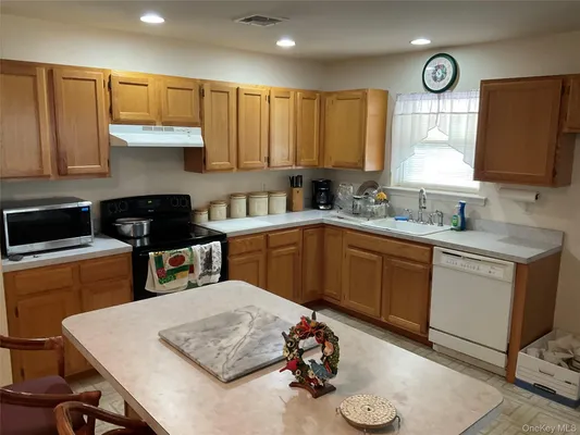Property Slideshow image 3 of 24 | 409 village cir, Manorville, NY, 11949