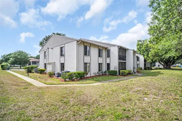Property Slideshow image 2 of 32 | 2642 pine ridge way g2, Palm Harbor, FL, 34684