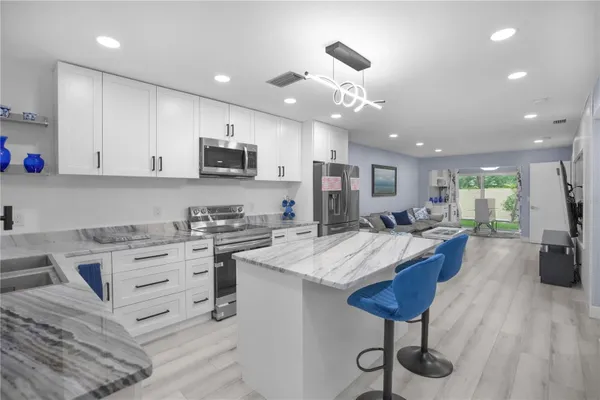 Property Slideshow image 2 of 56 | 1701 pinehurst rd 33e, Dunedin, FL, 34698