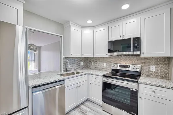 Property Slideshow image 3 of 50 | 1740 pine valley dr 313, Fort Myers, FL, 33907