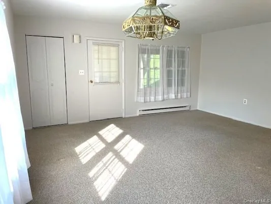 Property Slideshow image 2 of 14 | 120 exmore ct d, Ridge, NY, 11961