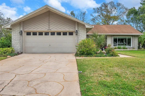 Property Slideshow image 3 of 72 | 1658 macdonnell ct, Palm Harbor, FL, 34684