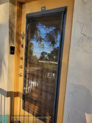 Property Slideshow image 2 of 16 | 4965 e sabal palm blvd 201, Tamarac, FL, 33319
