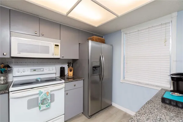 Property Slideshow image 3 of 43 | 11140 carriage hill dr 4, Port Richey, FL, 34668