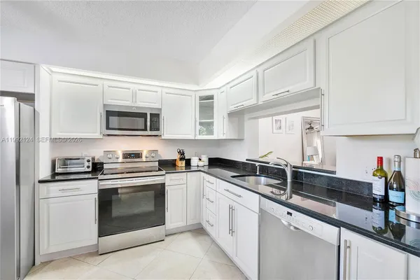 Property Slideshow image 3 of 13 | 1301 sw 142nd ave 203h, Pembroke Pines, FL, 33027