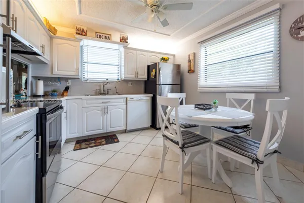 Property Slideshow image 3 of 25 | 4940 e sabal palm blvd 414, Tamarac, FL, 33319