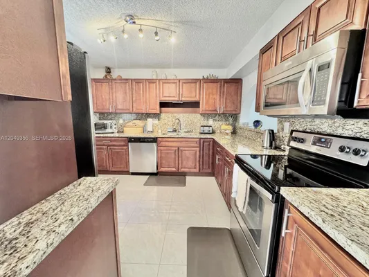 Property Slideshow image 3 of 29 | 4975 e sabal palm blvd 311, Tamarac, FL, 33319