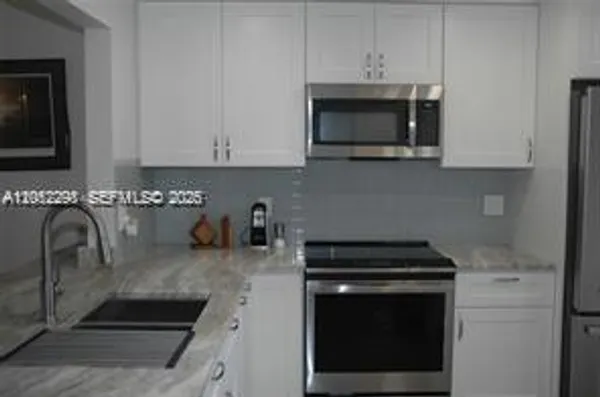 Property Slideshow image 2 of 48 | 3571 inverrary dr 201, Lauderhill, FL, 33319