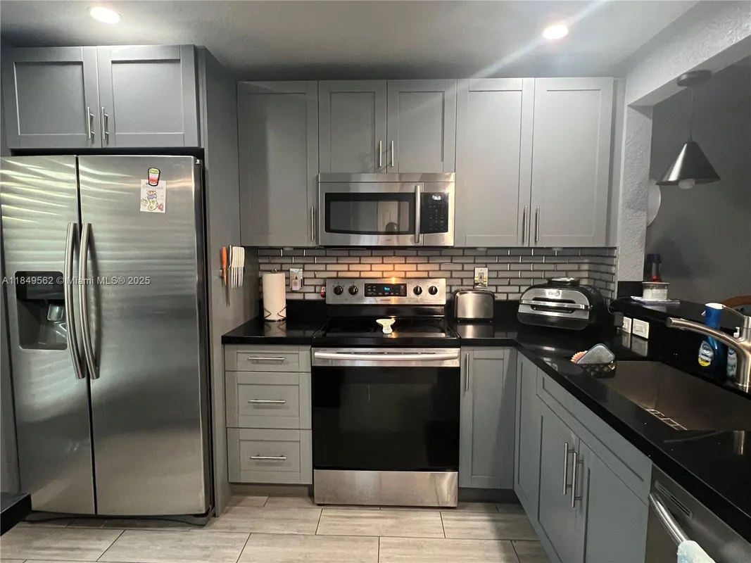 Property Slideshow image 1 of 19 | 5830 nw 64th ave apt 103, Tamarac, FL, 33319