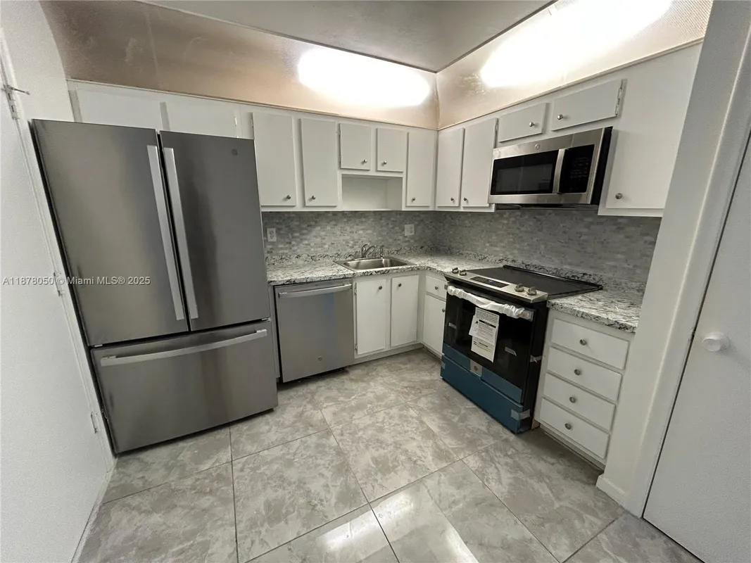 Property Slideshow image 1 of 17 | 2061 nw 47th ter 212, Lauderhill, FL, 33313