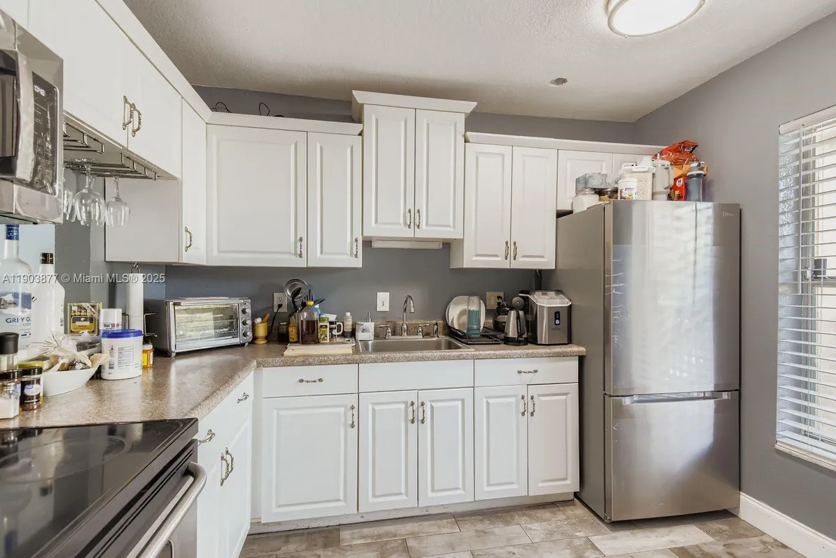 Property Slideshow image 1 of 13 | 6300 nw 62nd st 210, Tamarac, FL, 33319