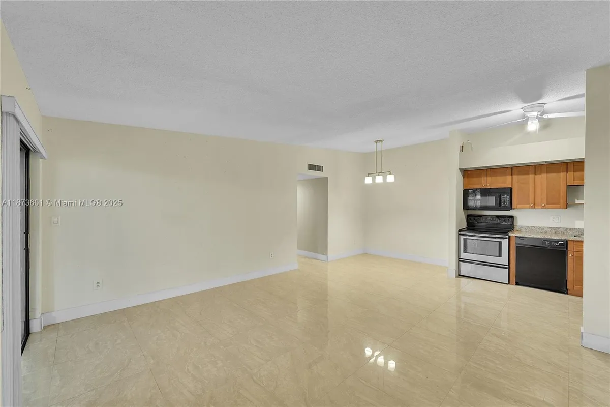 Property Slideshow image 1 of 25 | 9644 s belfort cir 211, Tamarac, FL, 33321
