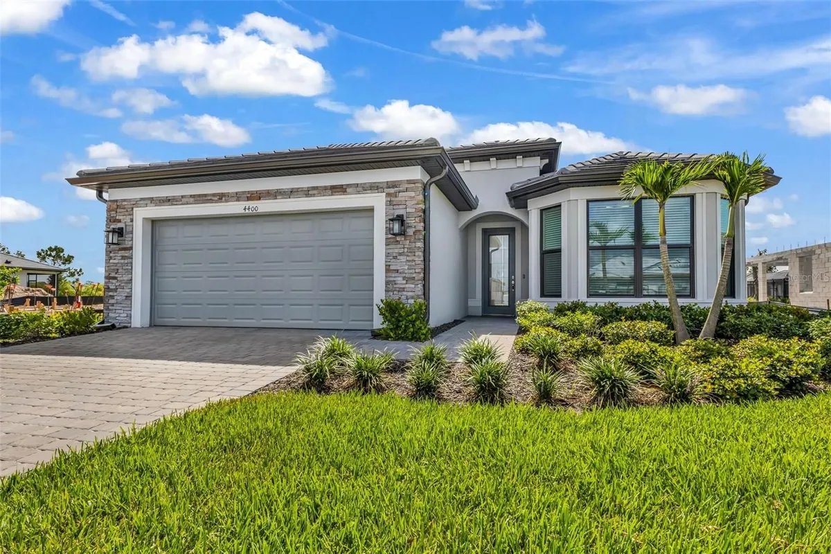 Property Slideshow image 1 of 75 | 4400 lakeside grove pl, North Port, FL, 34289