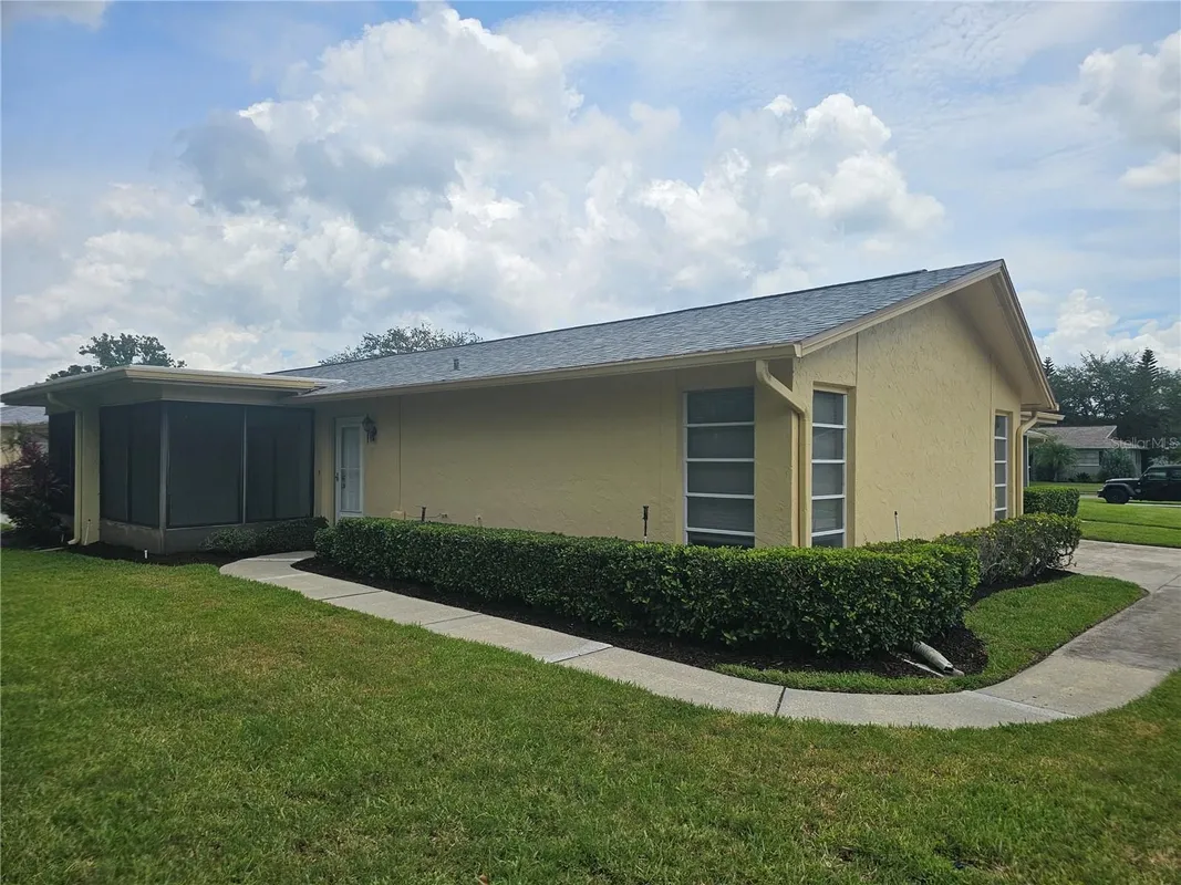 Property Slideshow image 1 of 18 | 1107 queen anne dr c, Palm Harbor, FL, 34684