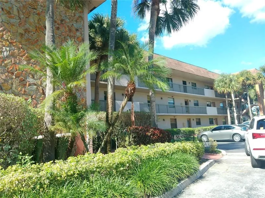 Property Slideshow image 1 of 23 | 6085 n sabal palm blvd 109, Tamarac, FL, 33319
