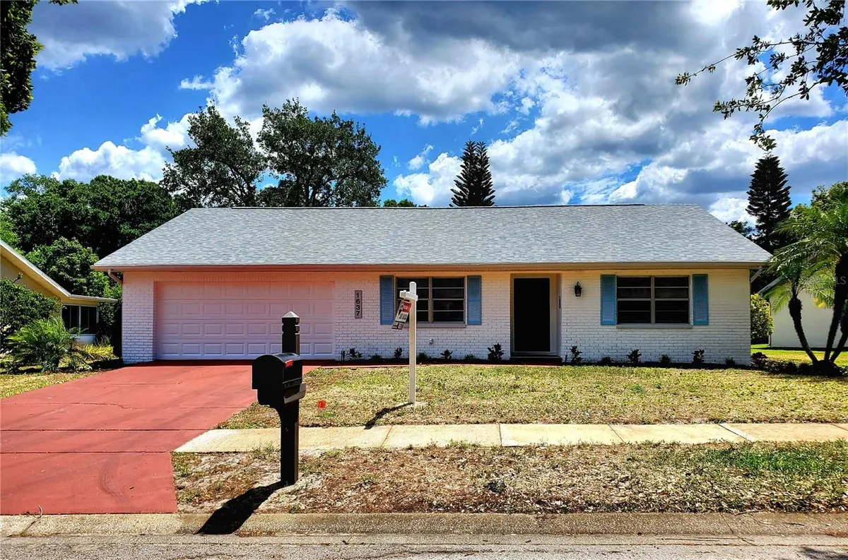 Property Slideshow image 1 of 45 | 1637 caledonia dr, Palm Harbor, FL, 34684