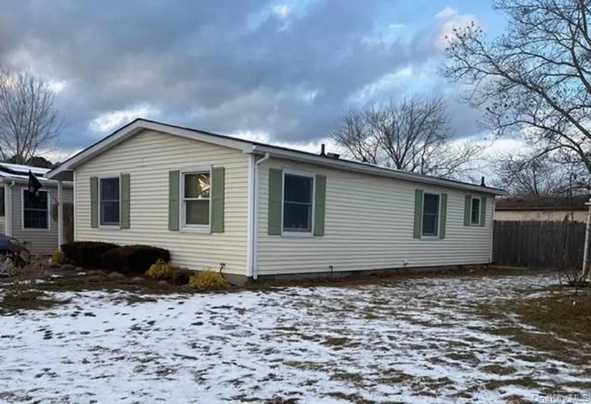 Property Slideshow image 1 of 2 | 42 village cir, Manorville, NY, 11949