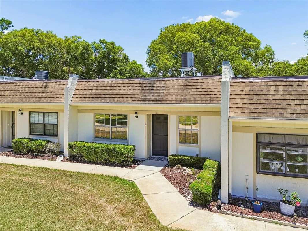 Property Slideshow image 1 of 36 | 11340 carriage hill dr 4, Port Richey, FL, 34668