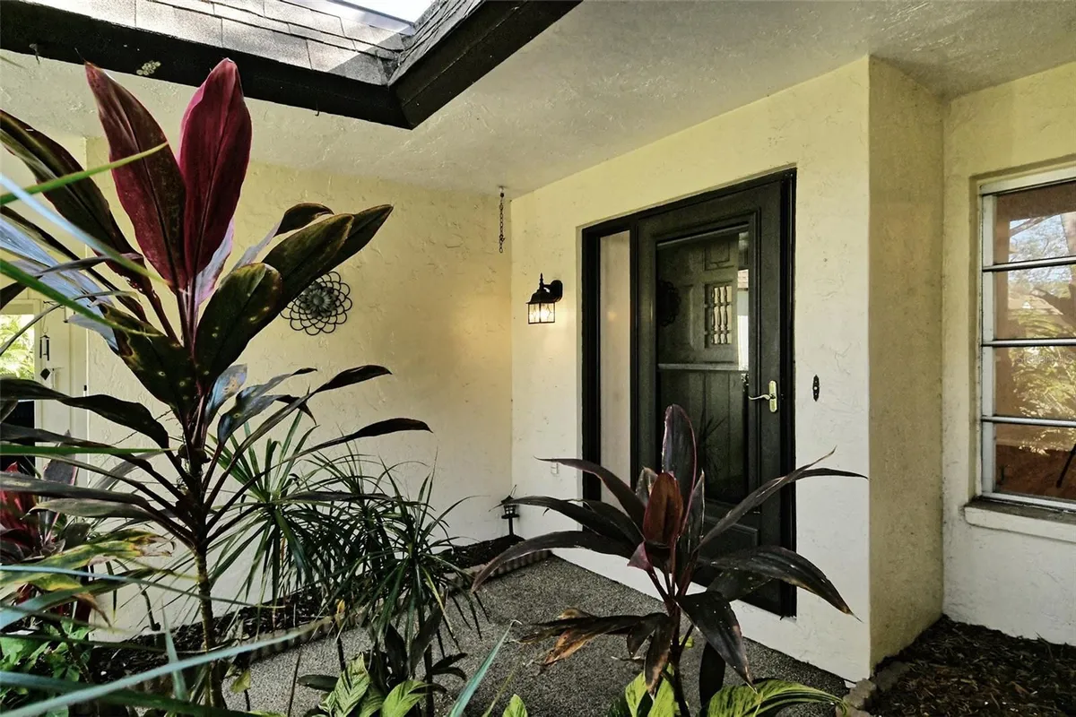 Property Slideshow image 1 of 37 | 6947 woodwind dr 77, Sarasota, FL, 34231