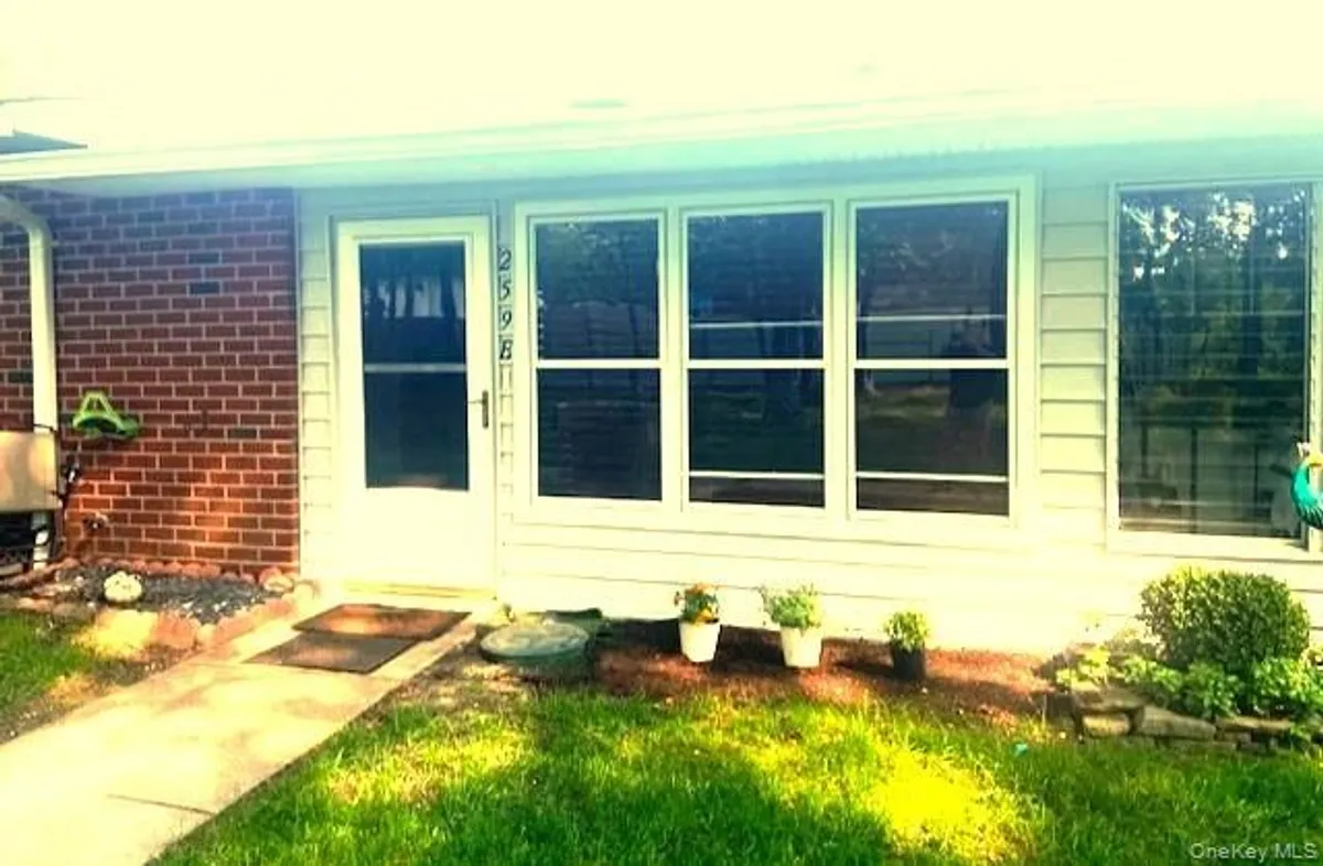 Property Slideshow image 1 of 21 | 259 newcastle ct e, Ridge, NY, 11961