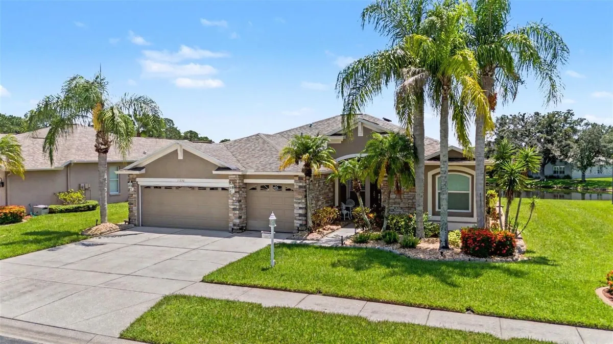 Property Slideshow image 1 of 58 | 11230 wedgemere dr, Trinity, FL, 34655
